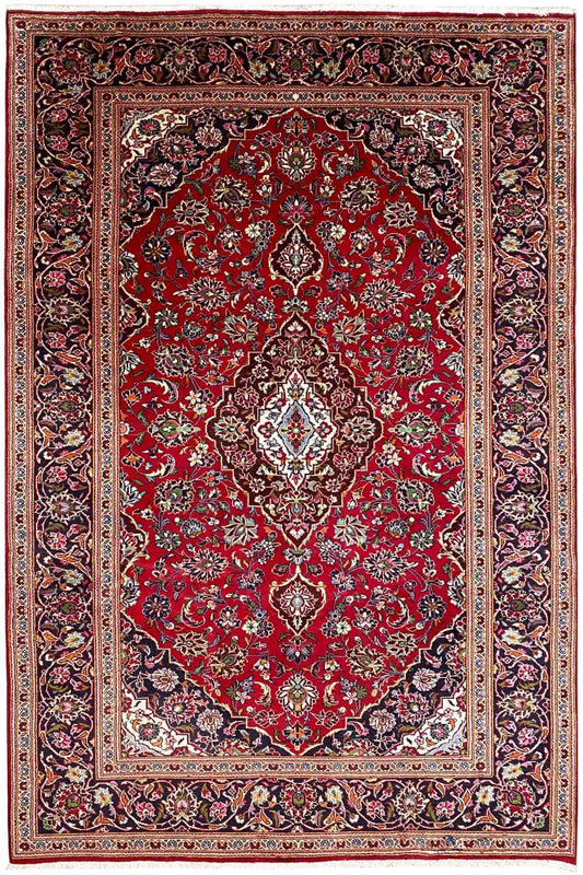 Rug with a red central field, white and beige medallions, and a multicolored border stripe