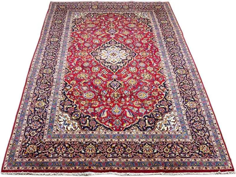 Burgundy-red carpet with a central medallion, surrounding border, and patterned frame