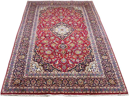Burgundy-red carpet with a central medallion, surrounding border, and patterned frame