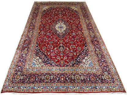 Red Keshan rug with an ornamental medallion and wide border design, 361x250 cm