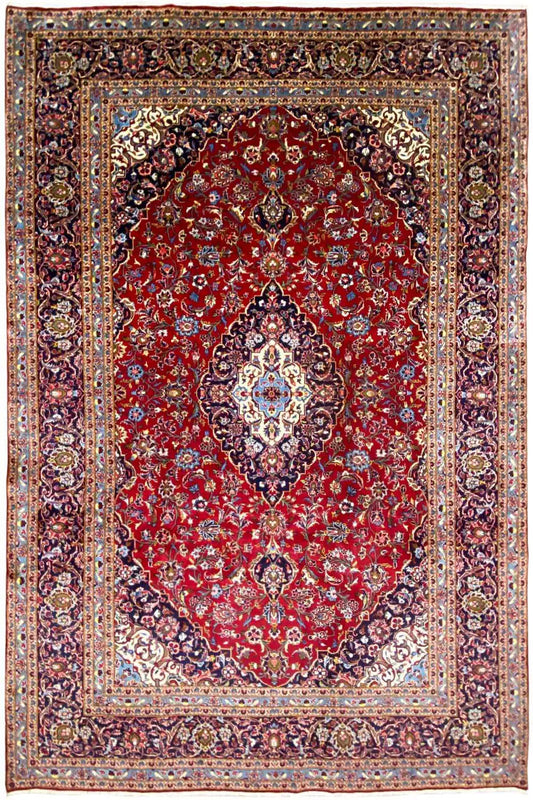 Straight Keshan rug in red with a central medallion and varied ornamental border.