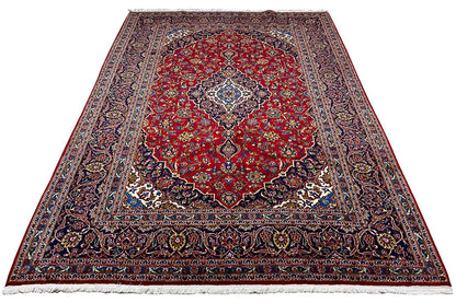 Keshan rug 296x204 cm with a red central medallion, dark blue border and fringes
