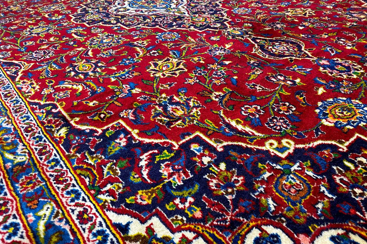 Carpet detail with floral ornaments in red, blue, green, and yellow