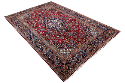 Rug with a red background, finely detailed ornaments, and a decorative border at the corners