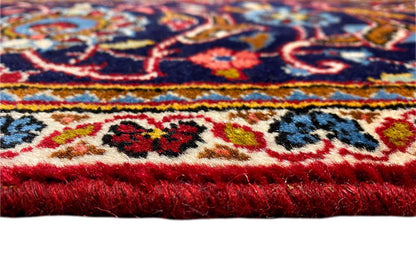 Carpet border in detail: colorful ornaments on a red background, with short pile