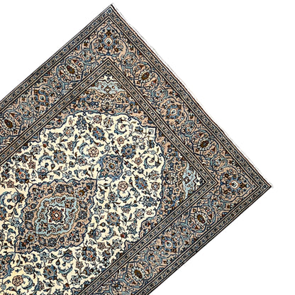Keshan rug 294x194 cm corner view with blue ornamental border and central motif