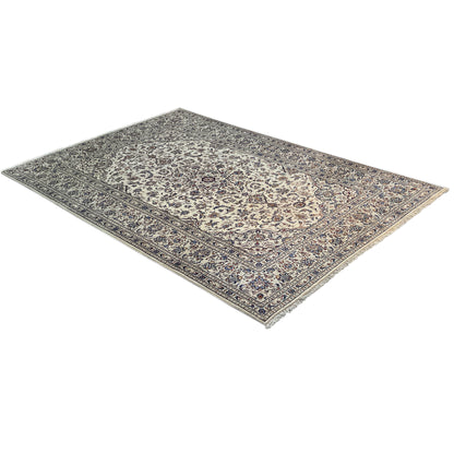 Keshan rug in landscape format with a gray-blue ornamental field and beige accents