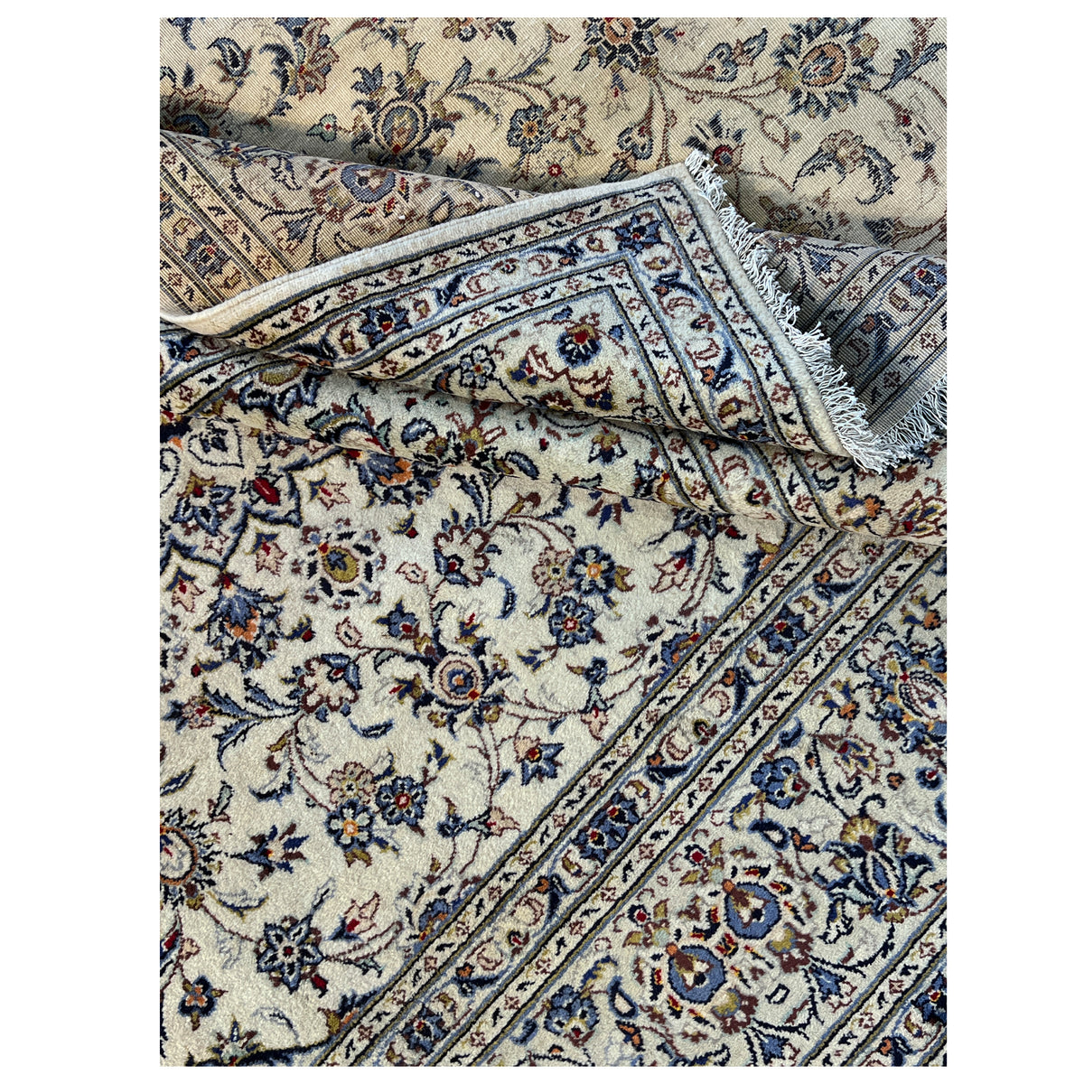 Keshan rug detail view: Overlap with blue border frame and ornaments