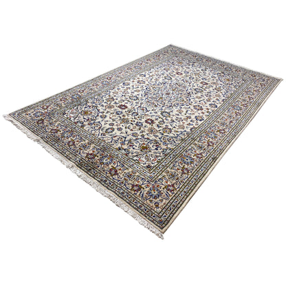 Keshan rug with a cream-colored center and a detailed blue and colorful border