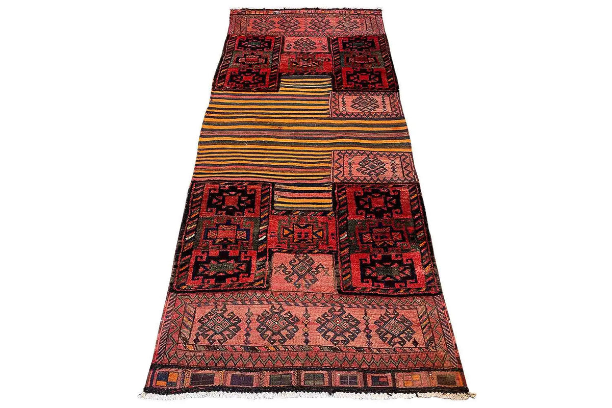 Kilim rug slightly angled, geometric patterns in red and beige with a dark border