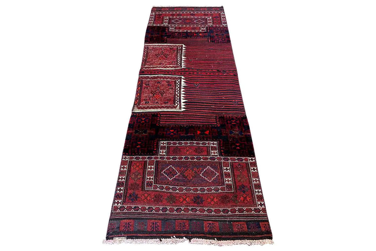 Bakhtiari kilim rug laid lengthwise: central fields with diamonds, red and dark-blue ornamentation.