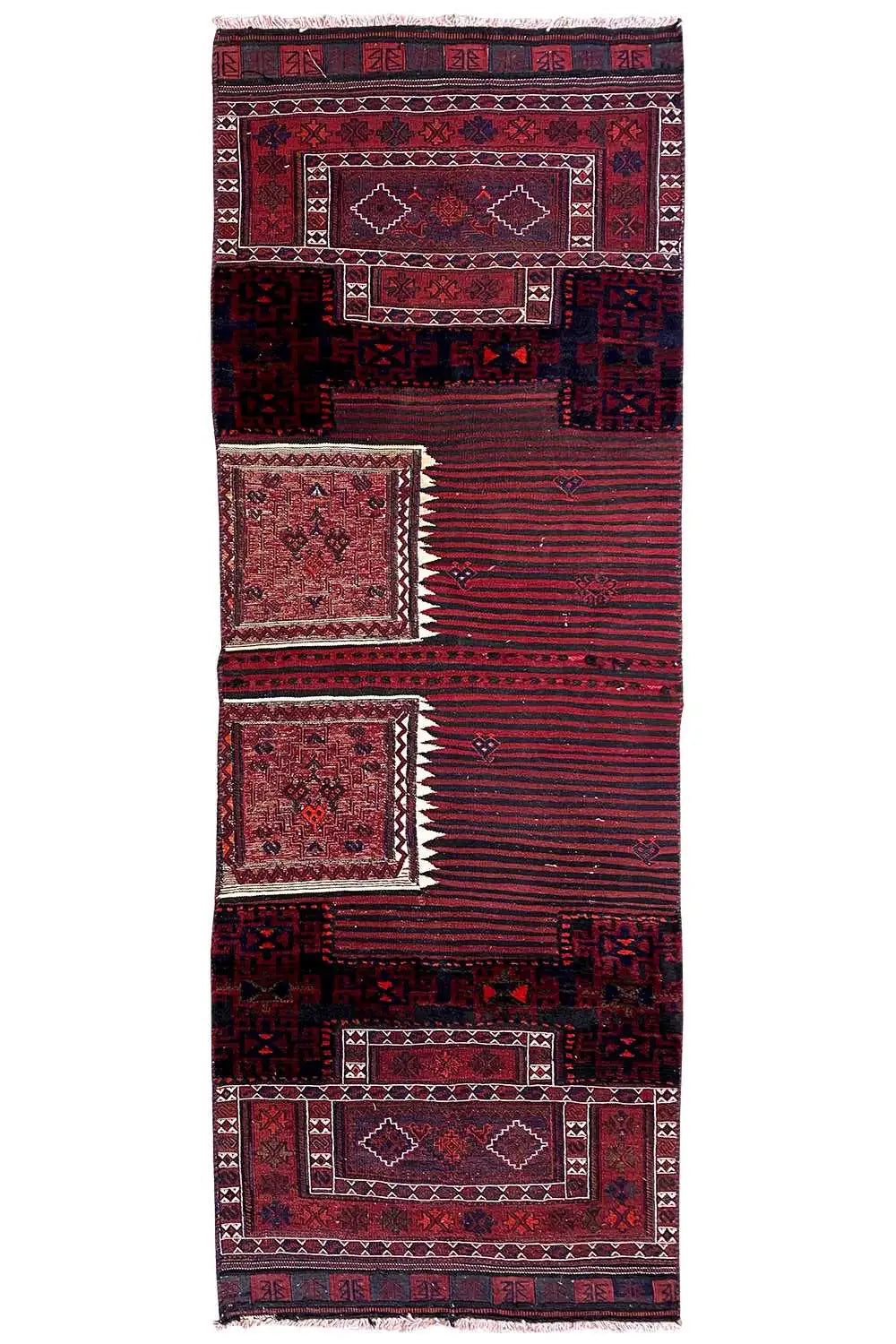 Bakhtiari kilim rug in full view: red borders, dark blue patterns, fringes at the top.