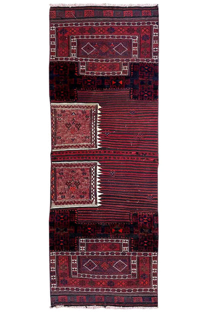 Bakhtiari kilim rug in full view: red borders, dark blue patterns, fringes at the top.