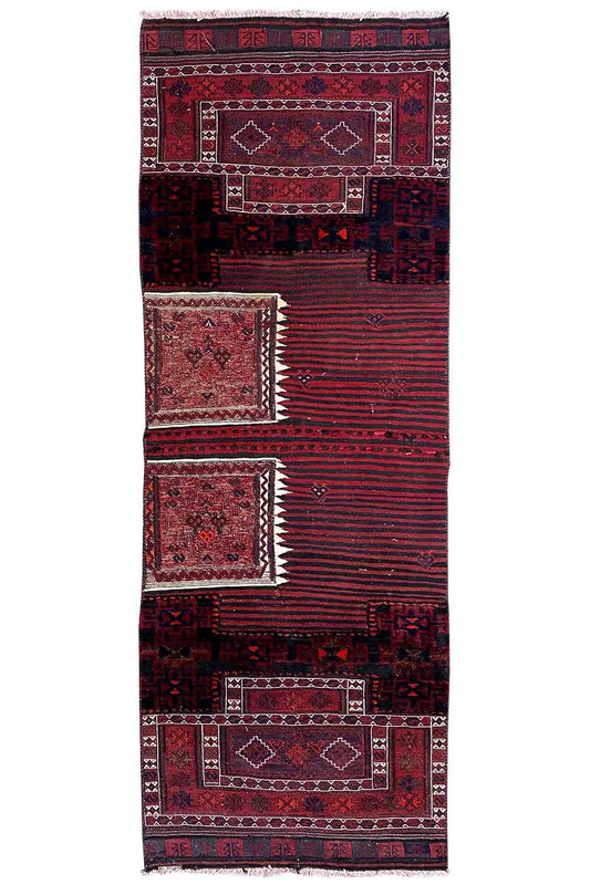 Bakhtiari kilim rug in full view: red borders, dark blue patterns, fringes at the top.
