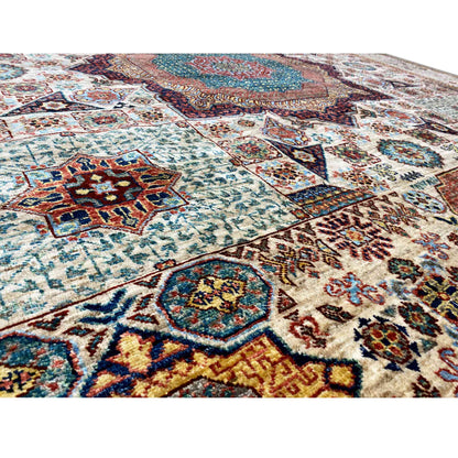 Close-up of the wool rug: dense pattern with colorful ornaments and visible pile texture