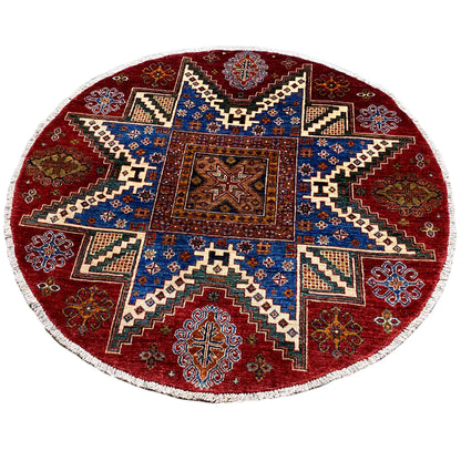 Round rug with a red background and blue ornamental pattern, white border