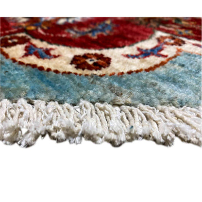 Khorjin rug hem: fringed edge, blue ornament beneath red border