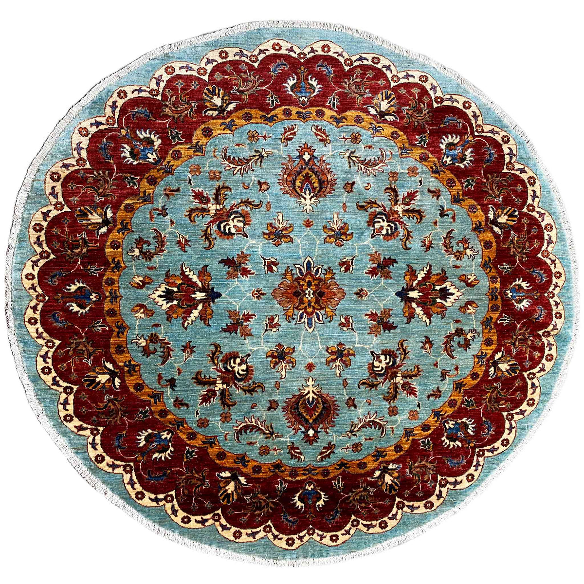 Round Khorjin rug: blue ornamental field, red medallion, floral border
