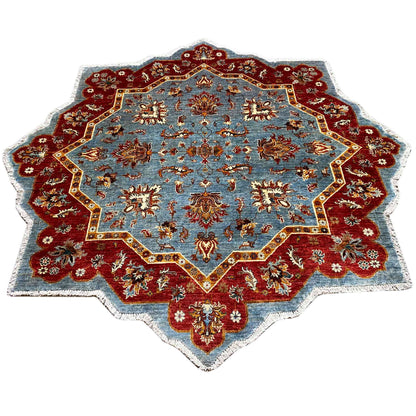 Star-shaped carpet with a blue central field, red border, and gold ornaments