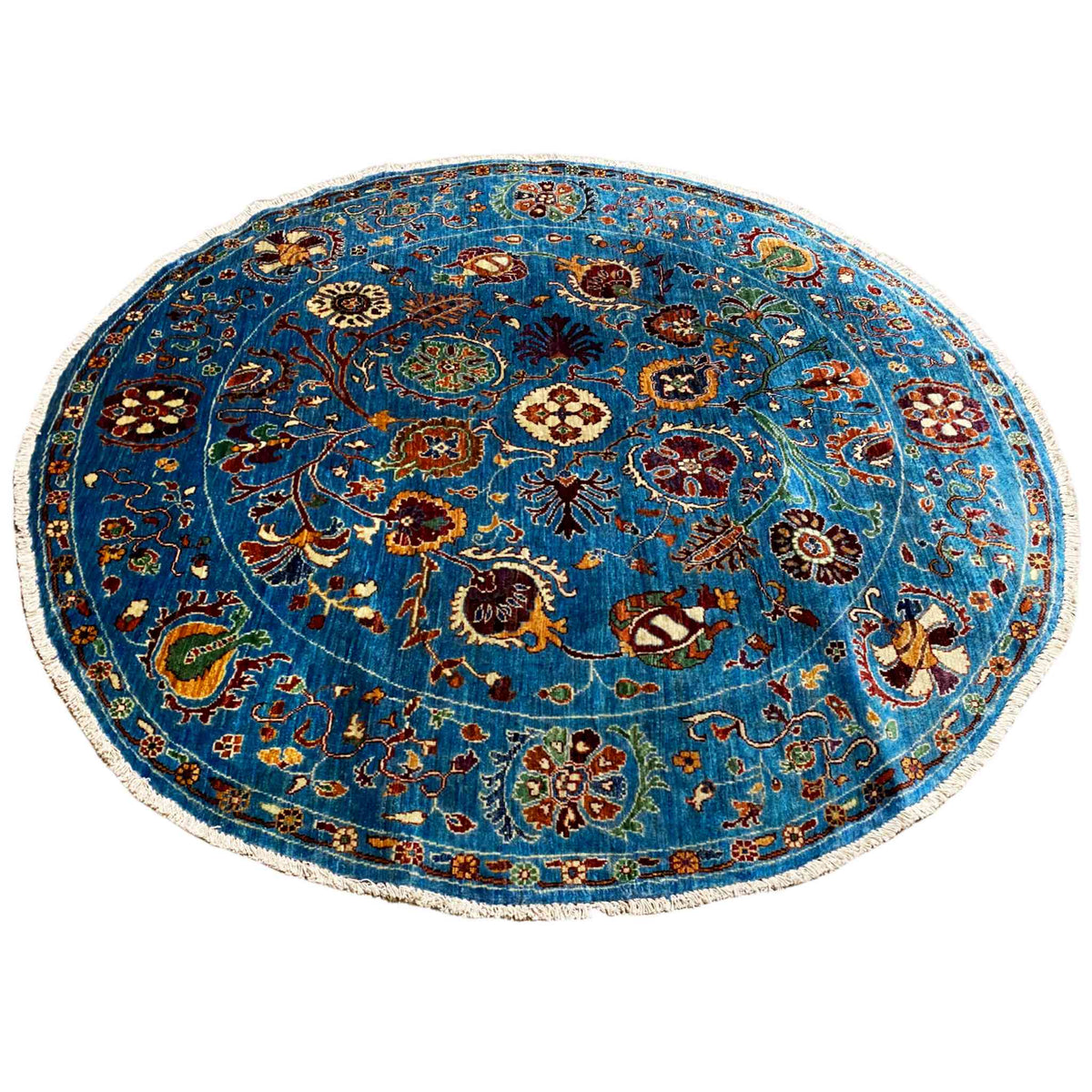 Round wool rug, blue medallion with many floral and animal ornaments