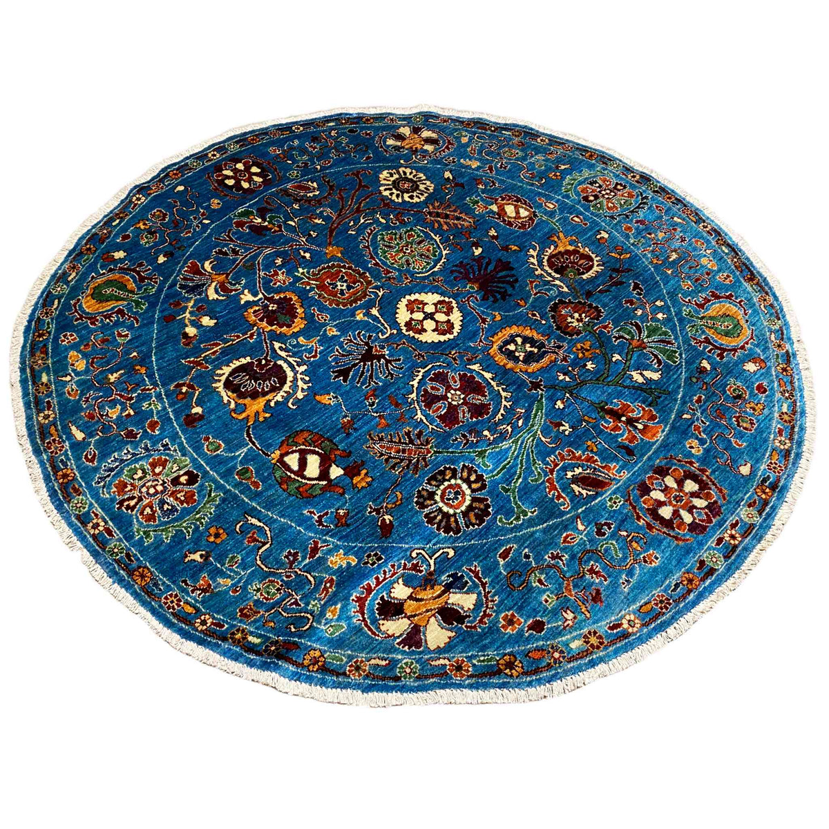 Round wool rug, blue, with a central medallion and an all-over pattern
