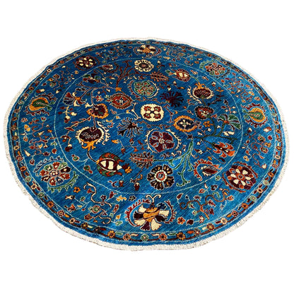Round wool rug, blue, with a central medallion and an all-over pattern