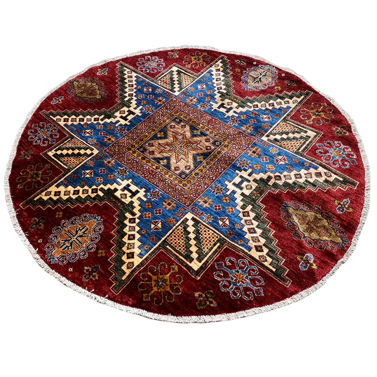 Round rug with a red background, blue central medallion, and geometric pattern