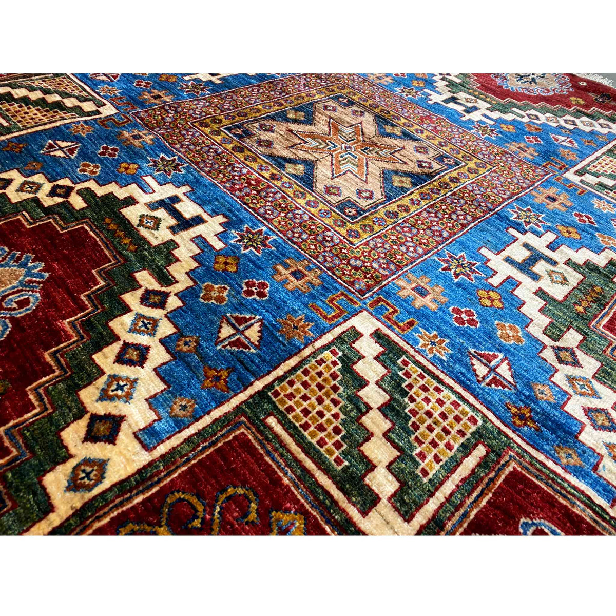 Carpet detail: blue-red ornaments, zigzag and diamond shapes