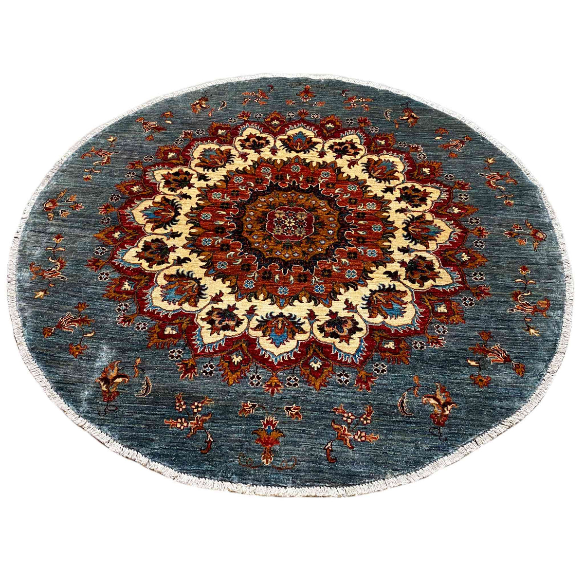Round rug with a central medallion and floral ornaments, blue-red-cream
