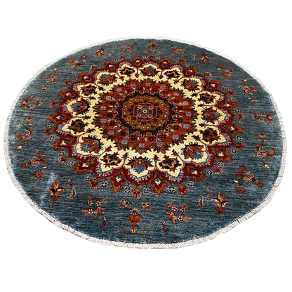 Round rug with a central medallion and floral ornaments, blue-red-cream