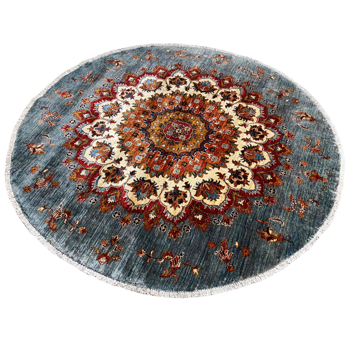 Round Khorjin rug with large floral medallions in red, cream, and blue