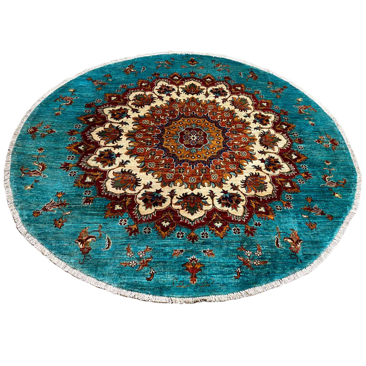 Round Khorjin rug: turquoise background with a detailed ornamental vignette in red, cream, and brown.