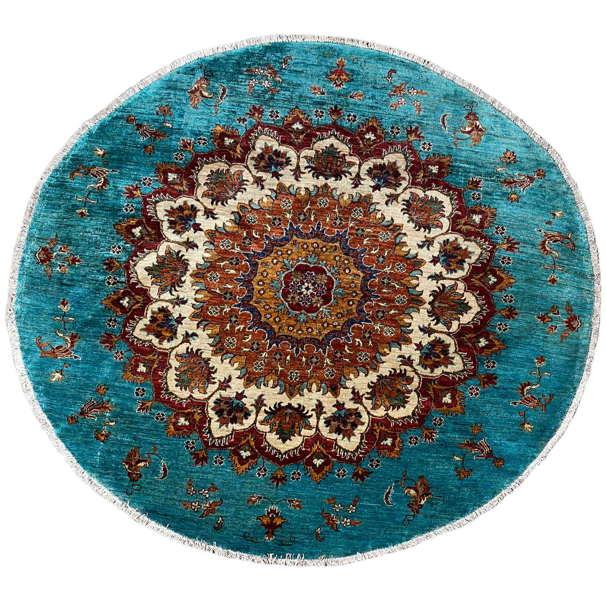 Round turquoise Khorjin rug with an ornate central medallion and multicolored pattern.
