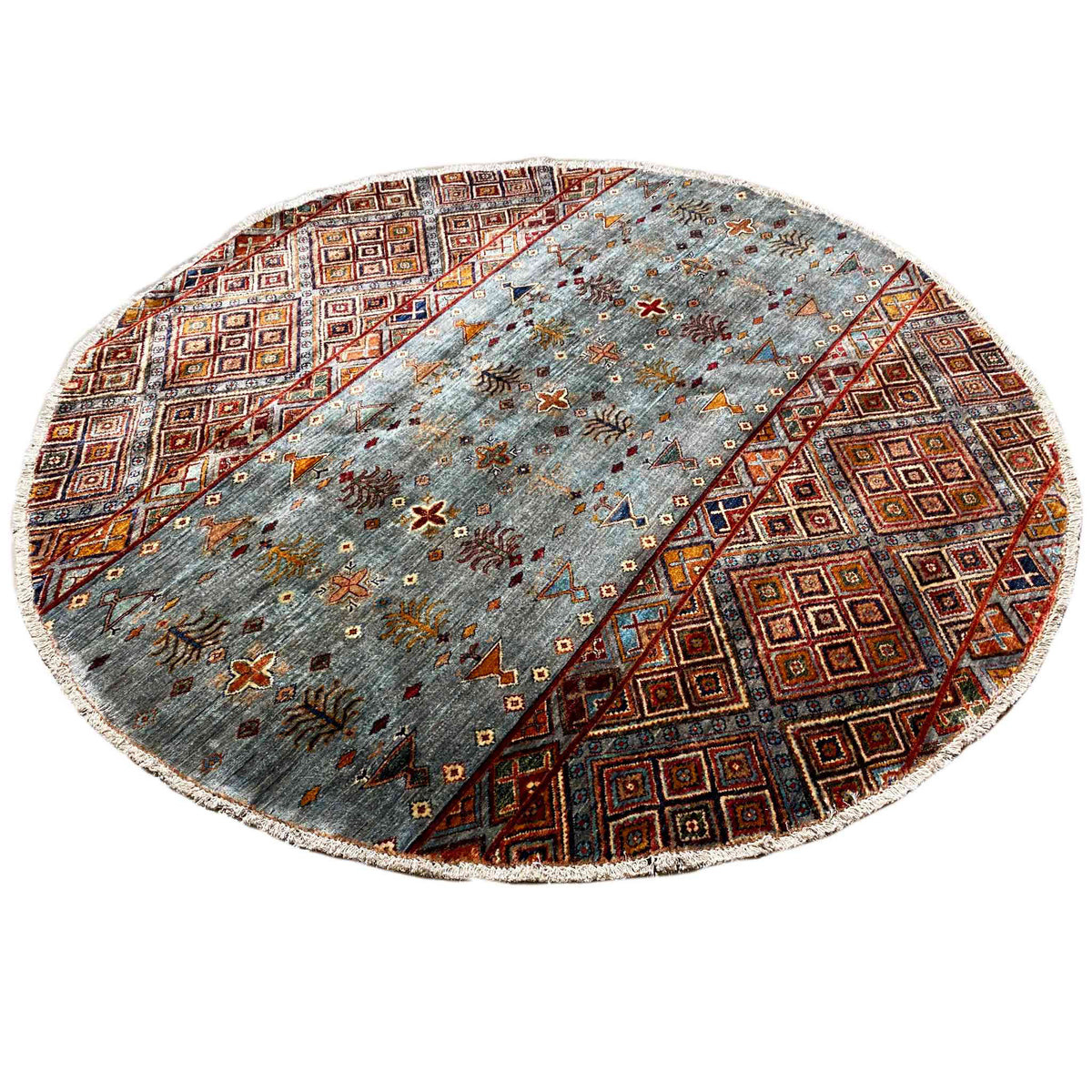 Round hand-knotted wool rug with a blue-gray background and colorful brown/orange ornaments