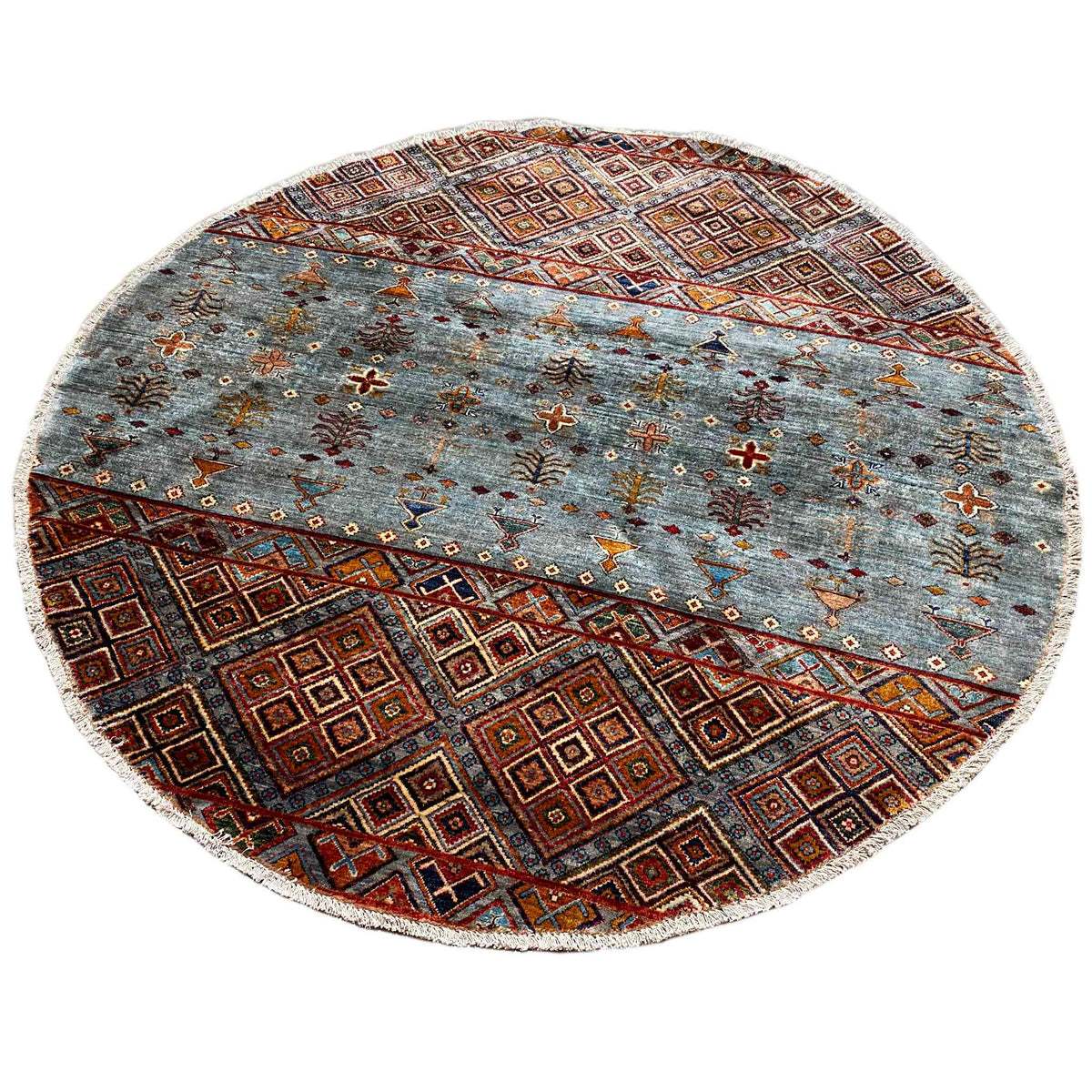 Round wool rug with a textured look, a blue-gray pattern, and a border in brown, orange, and reddish brown