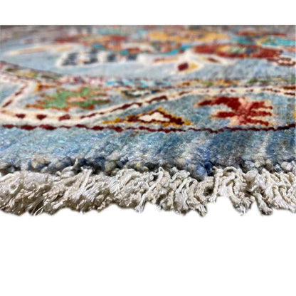 Khorjin wool rug: fringe edge and woven pile, blue with multicolored border