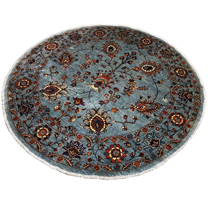 Hand-knotted round Khorjin rug, dense patterns in blue, dark brown, and red