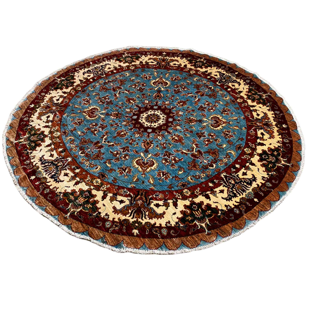 Round wool rug with a blue medallion, border, and baroque ornaments in brown