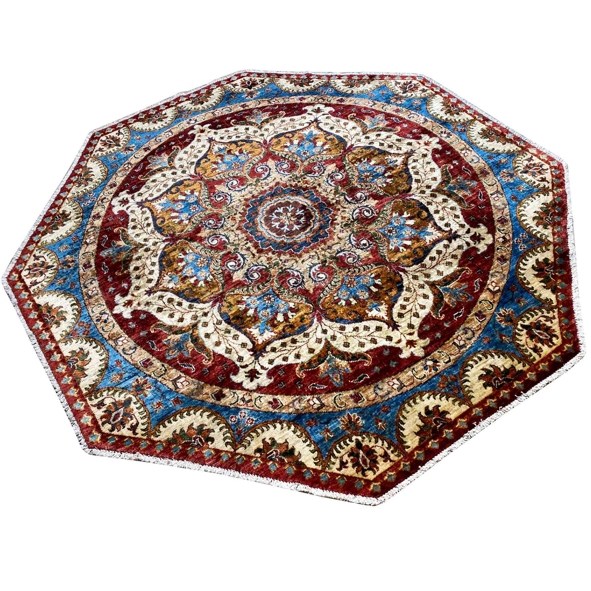 Octagonal rug with a red central medallion and blue border, richly ornamented