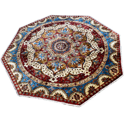 Octagonal rug with a red central medallion and blue border, richly ornamented
