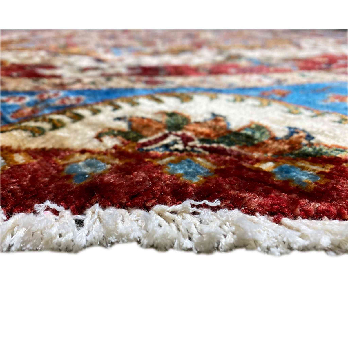 Octagonal rug: woven pile with a fringed finish along the edge