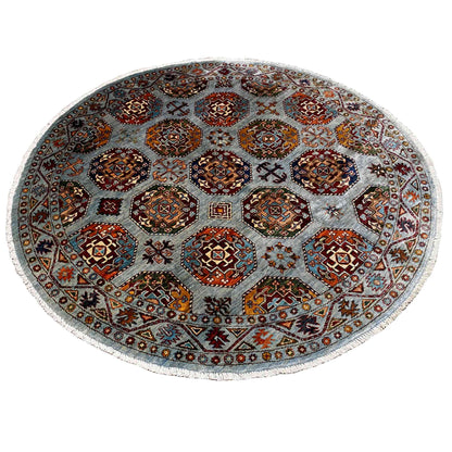Round rug with a dense pattern of squares and crosses, multicolored on a light background