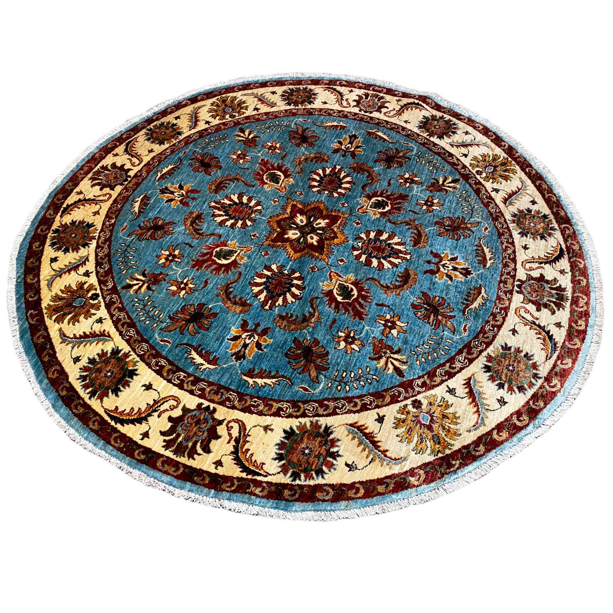 Circular rug with a blue field, cream-colored ornamental border, and dark accents