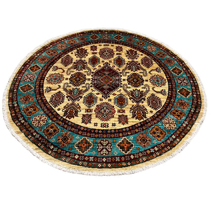 Round khorjin rug with a patchwork-style geometric pattern on a cream-colored background