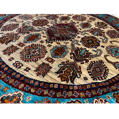 Close-up: Khorjin rug with geometric patterns in brown, turquoise, and cream