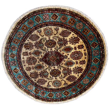 Round Khorjin rug with a cream-colored field and turquoise geometric patterns