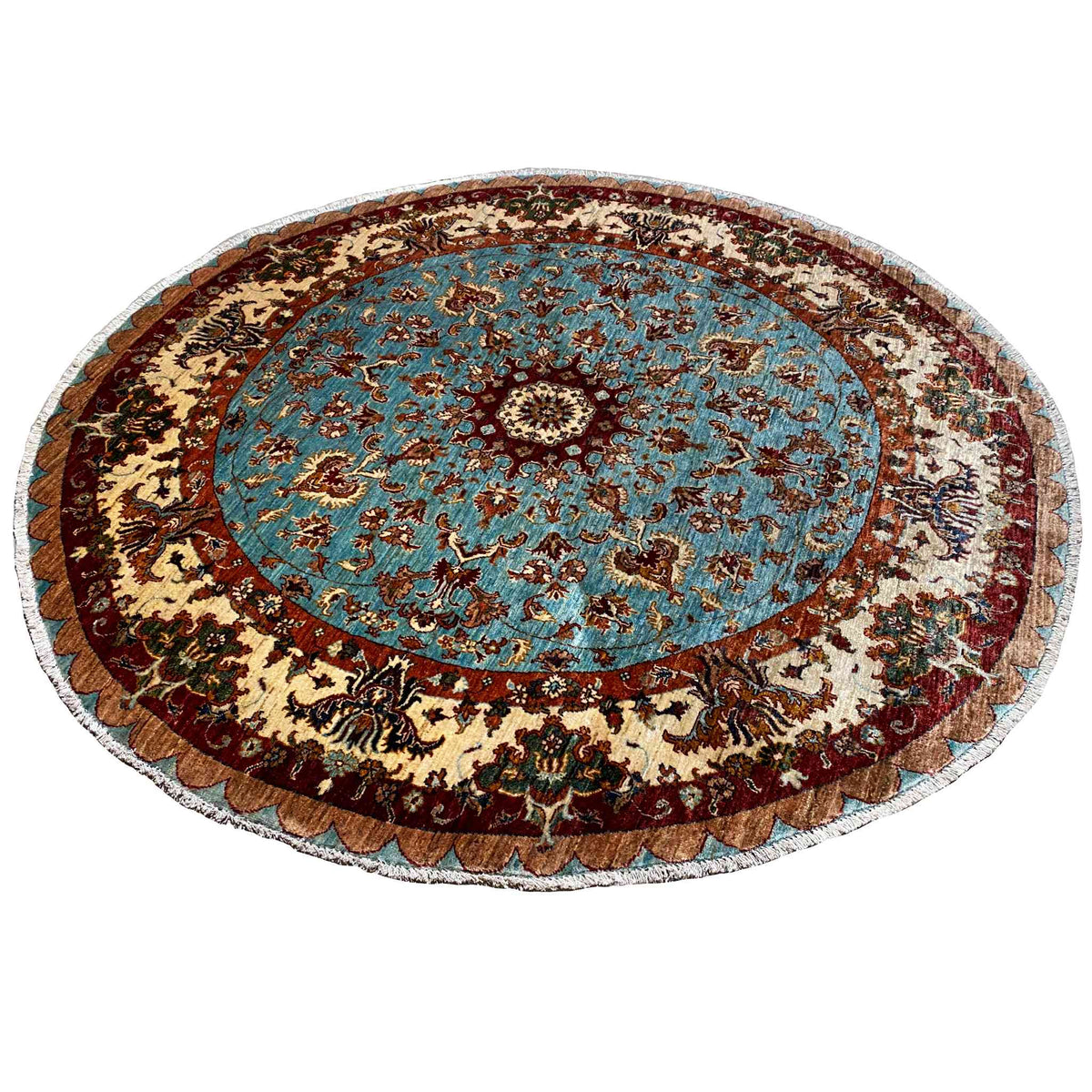 Round rug with a blue central medallion, dark decorative border, and beige ornamental wreath