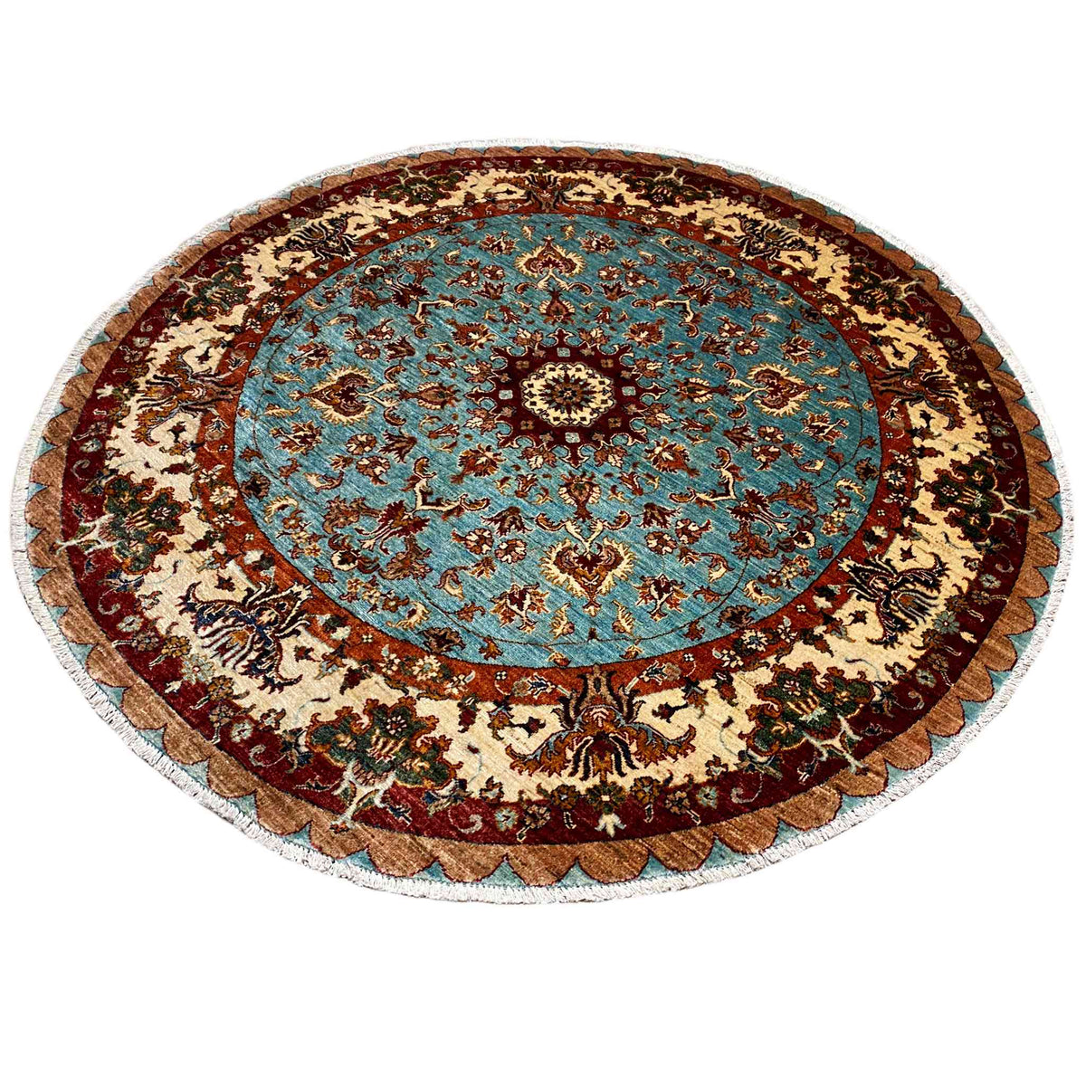 Round wool rug with a blue center and red-brown decorative border, with a velvety appearance