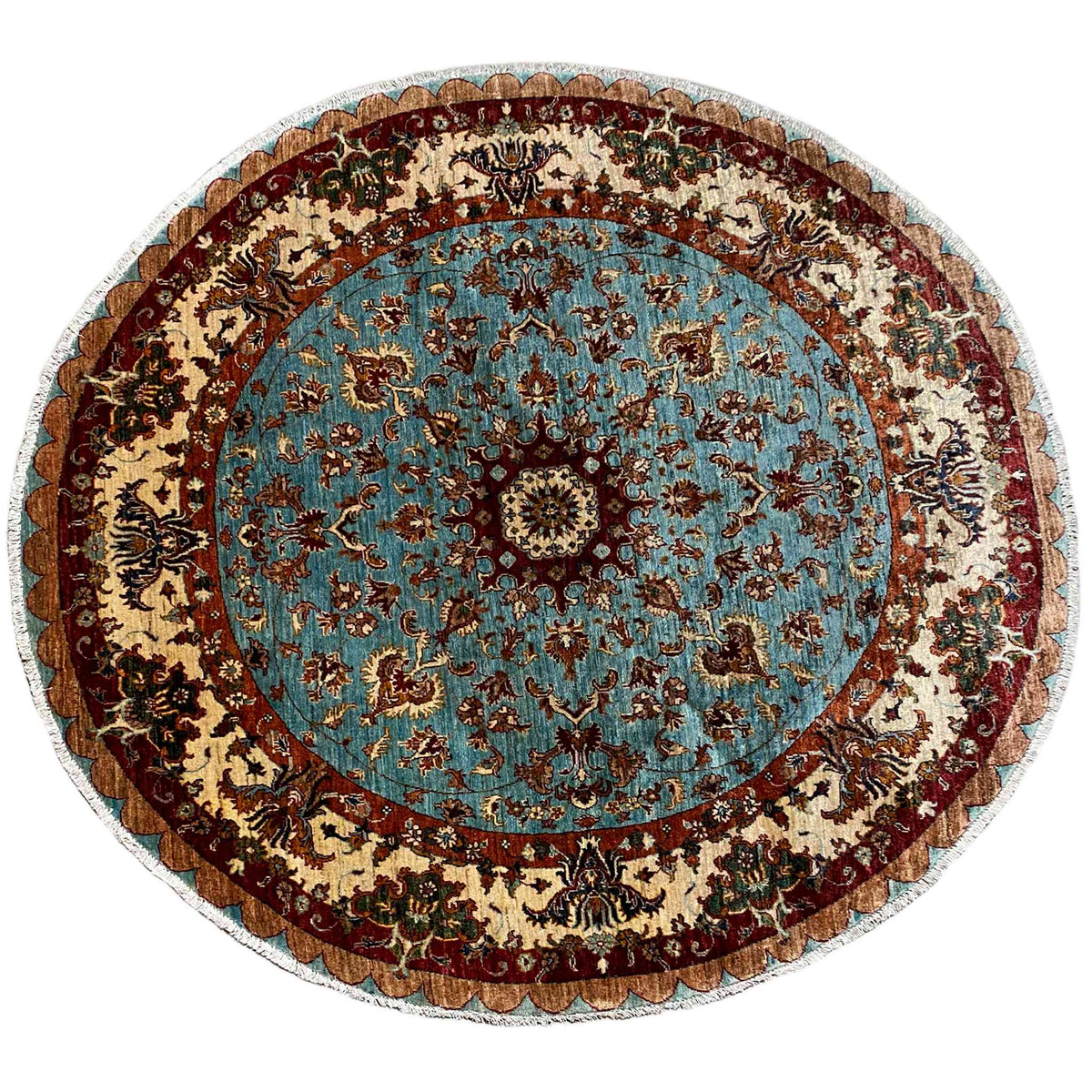 Round wool rug with a blue medallion and baroque ornamental pattern, border with a tassel look