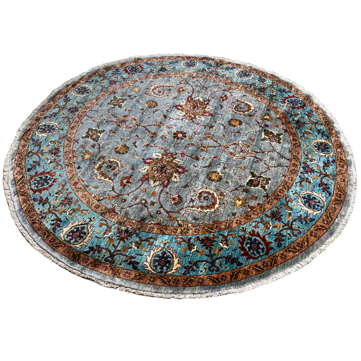 Round rug with a light blue central medallion, colorful floral motifs and decorative border
